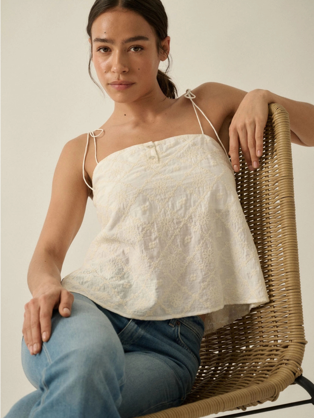 The Seafoam Embroidered Cami with delicate floral embroidery, thin spaghetti straps, and a straight neckline.