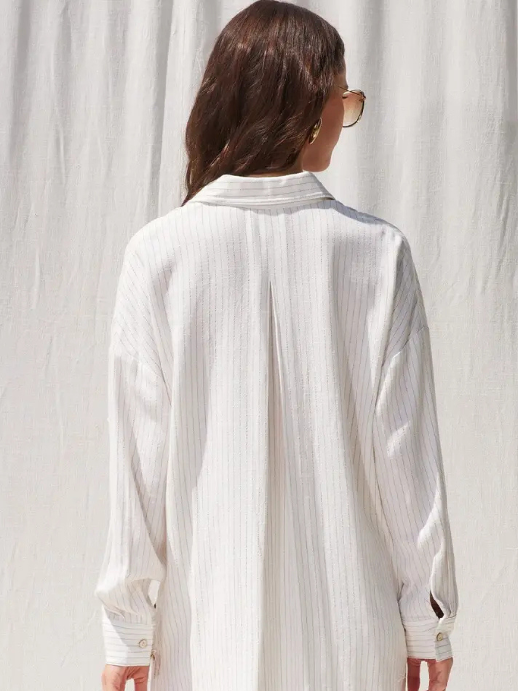 Flowy back view of The Seaside Stripe Linen Button-Down Top, perfect for breezy coastal outings. Effortless style!