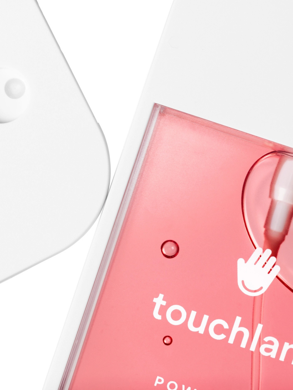Touchland Hydrating Hand Sanitizer in a pink translucent bottle with a lightweight micro-mist spray.