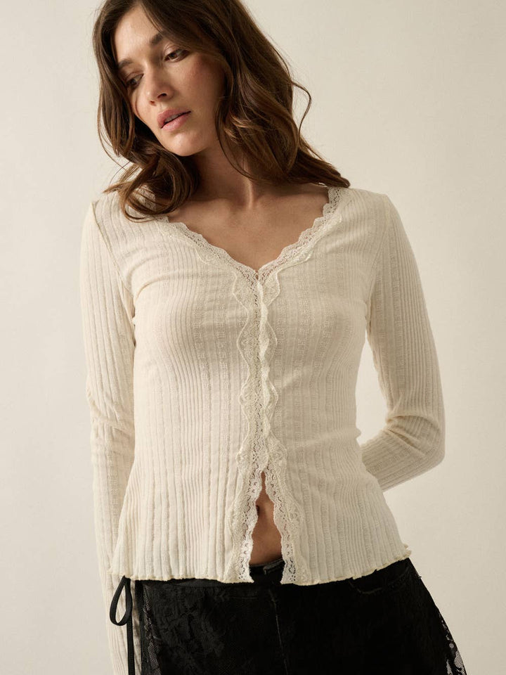 Juniper Lace-Trim Pointelle Sweater in Cream — studio view of scalloped lace trim and split-front hem | Jayden P Boutique