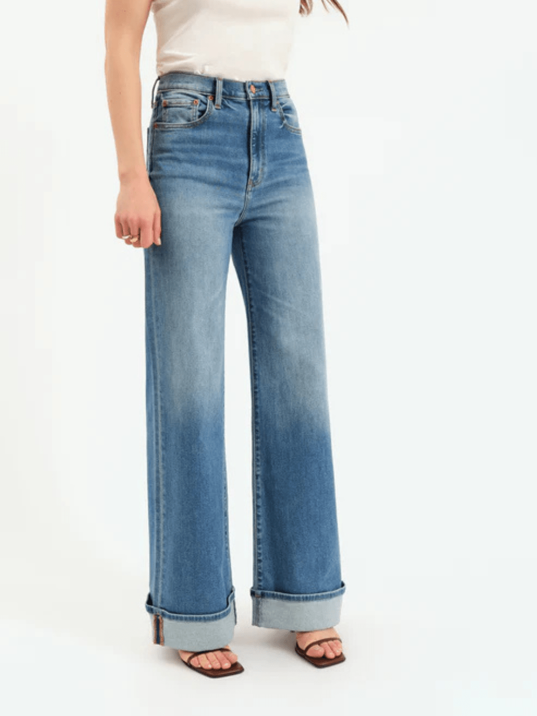 Daze Denim Far Out High Rise Wide Leg Jeans on a model with rolled cuffs.