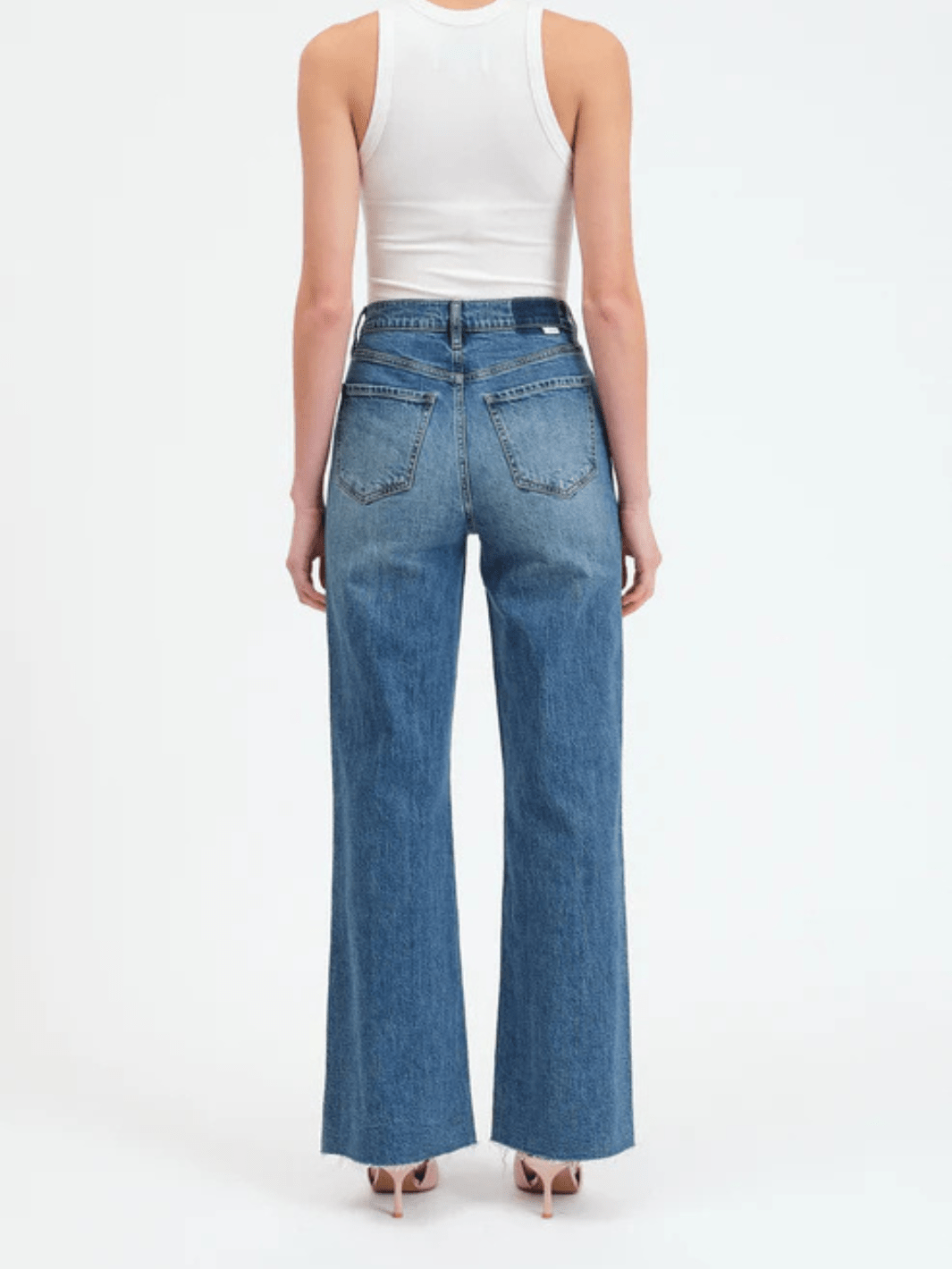 DAZE DENIM Far Out High Rise Wide Leg Jeans, back view of model in blue denim.