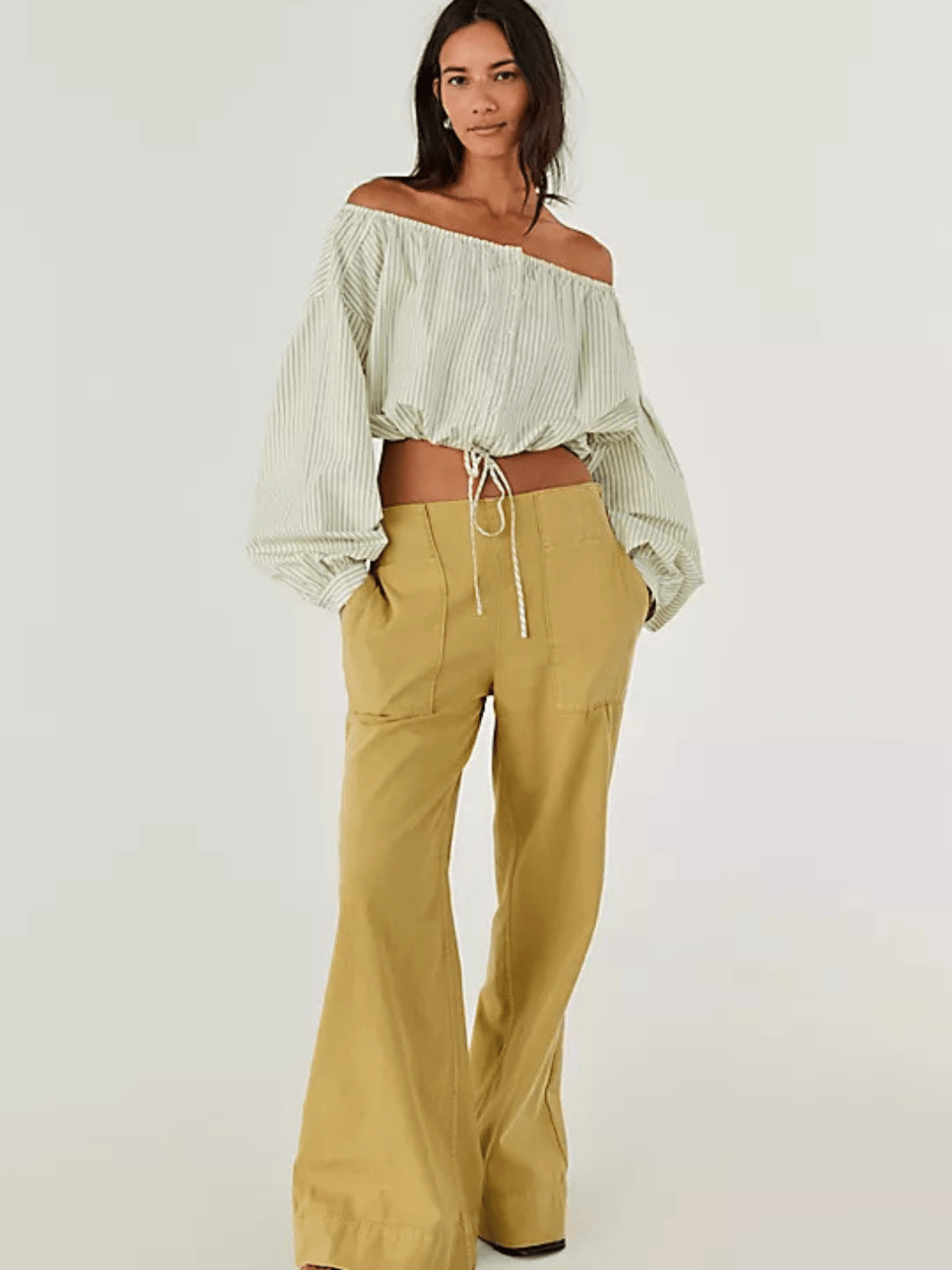 Model in Free People We The Free Breezy Denim Pull-On Jeans, mid-rise, soft-wash finish, laid-back luxe.