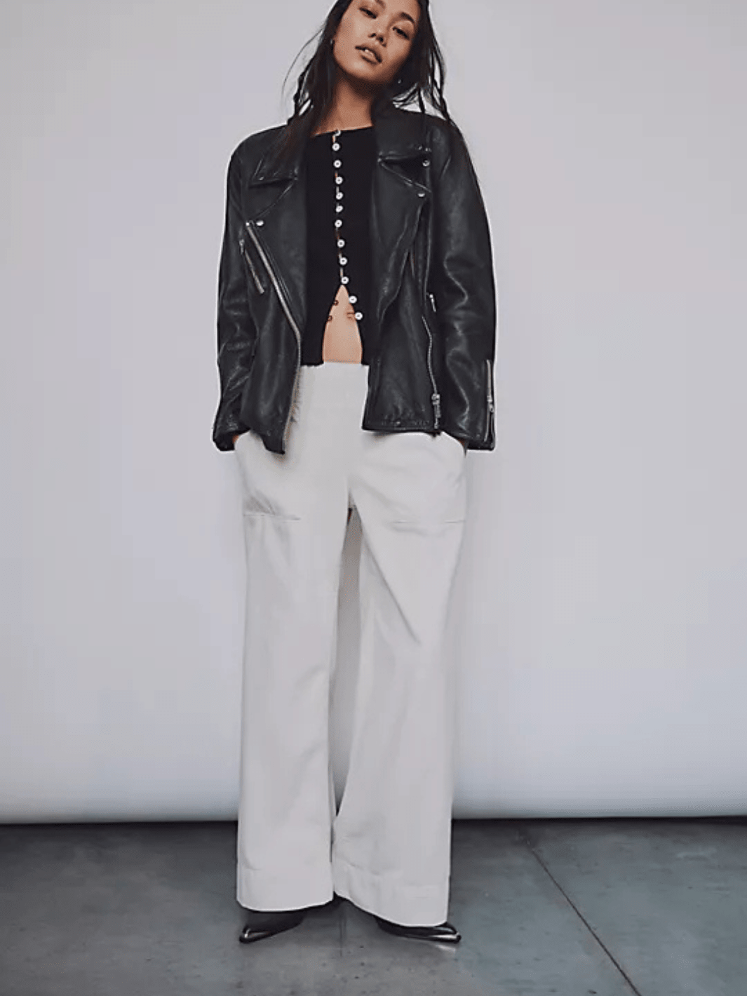 White breezy denim pull-on jeans, mid-rise, wide-leg, paired with black top and leather jacket