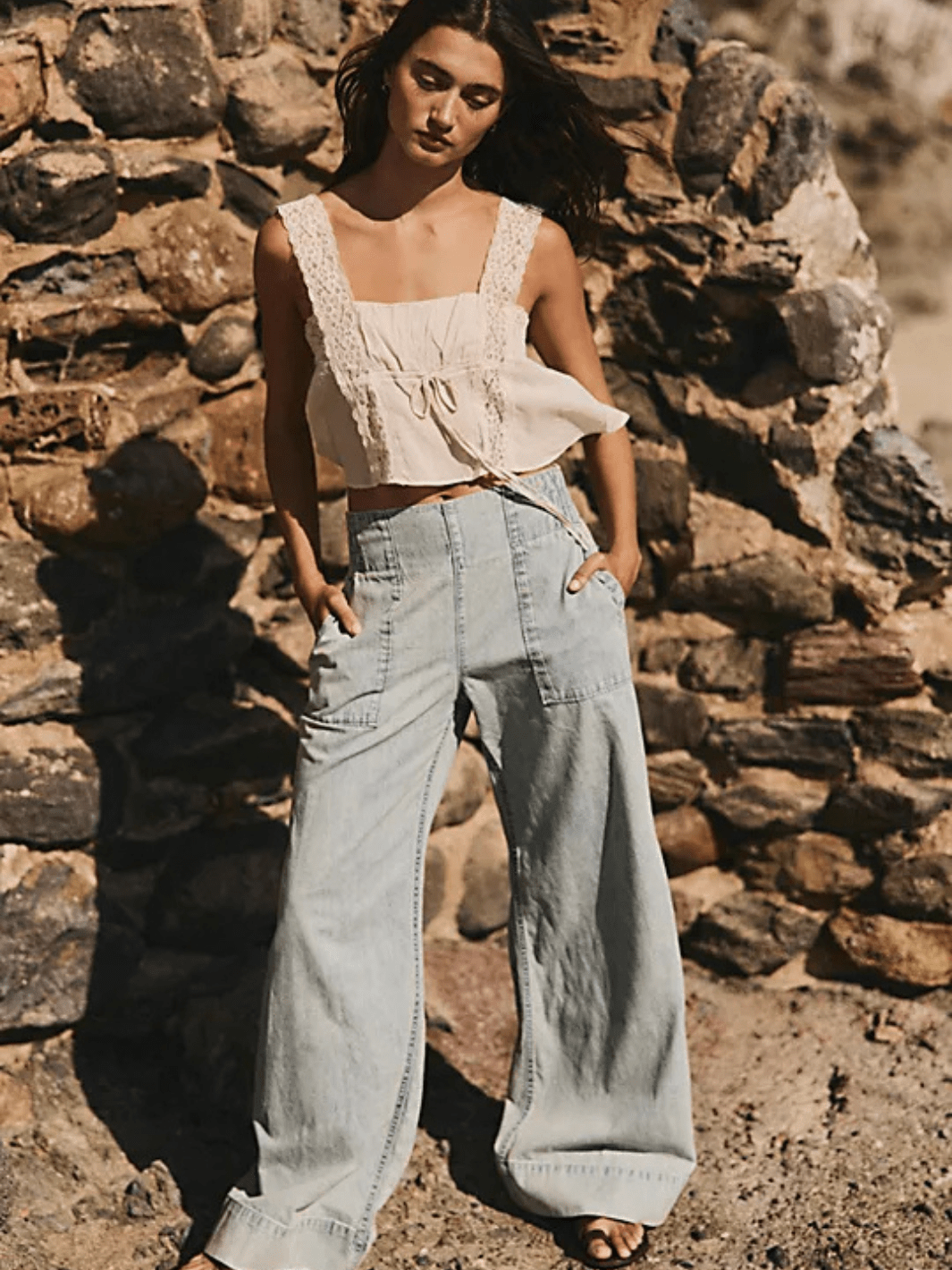 Free People We The Free Breezy Denim Pull-On Jeans, mid-rise light-wash wide-leg with front pockets.