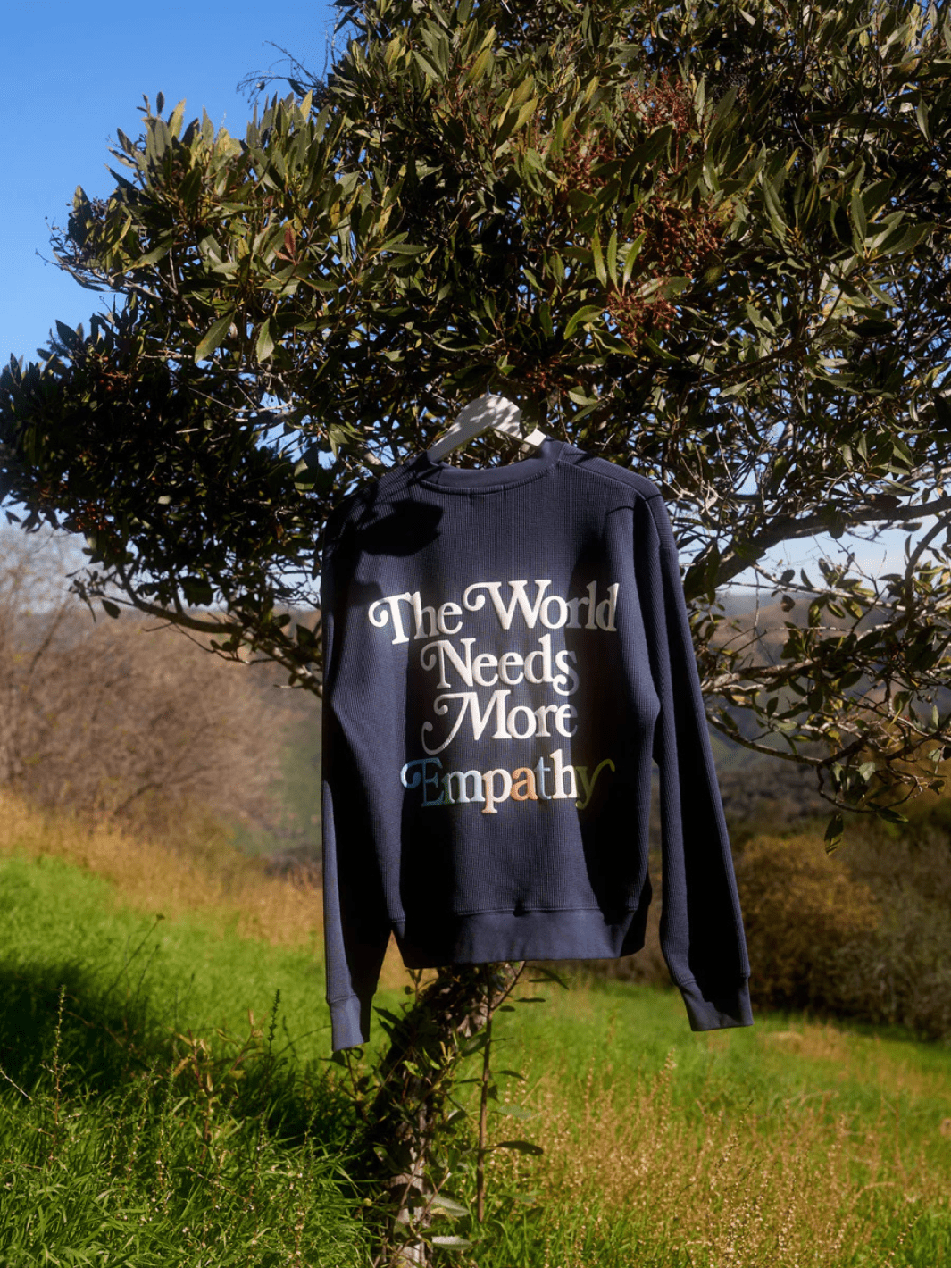 The Mayfair Group - World Needs More Empathy Waffle Classic Crewneck - Jayden P Boutique