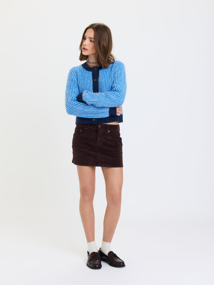 Daze Denim Fever Corduroy Micro Mini Skirt in Chocolate — front view styled with blue cardigan and loafers | Jayden P Boutique