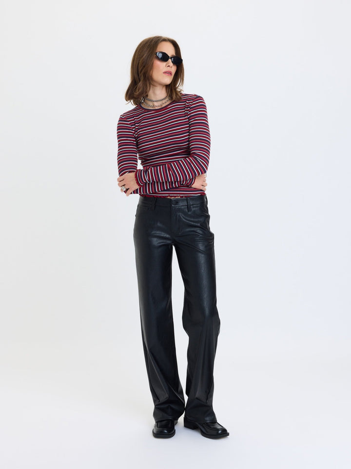 Daze Denim Keeper Faux Leather Low-Rise Straight Pants in Black — full-length front view styled with striped sweater | Jayden P Boutique