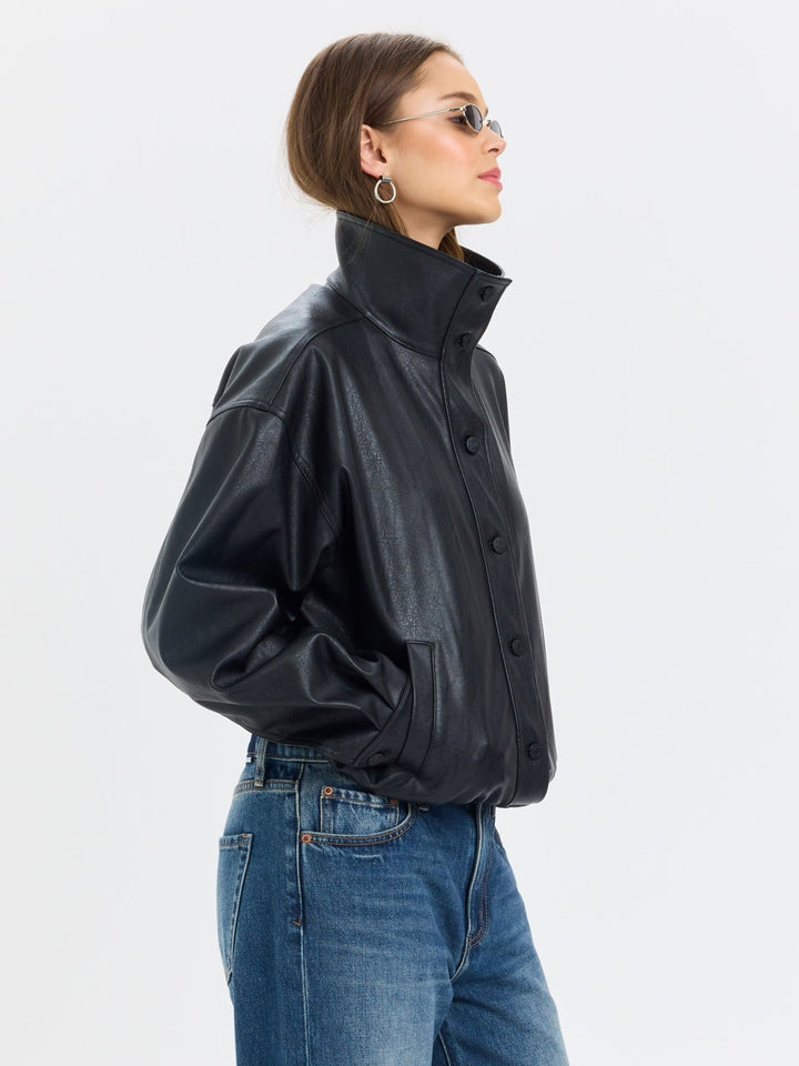 Daze Denim Phantom Faux Leather Jacket in Black — three-quarter back view of oversized black leather-look jacket | Jayden P Boutique