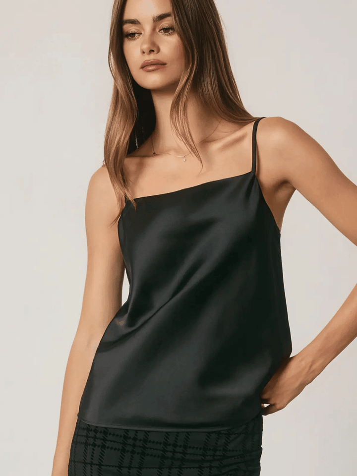 Women wearing black satin cami top with adjustable straps in square neckline style.