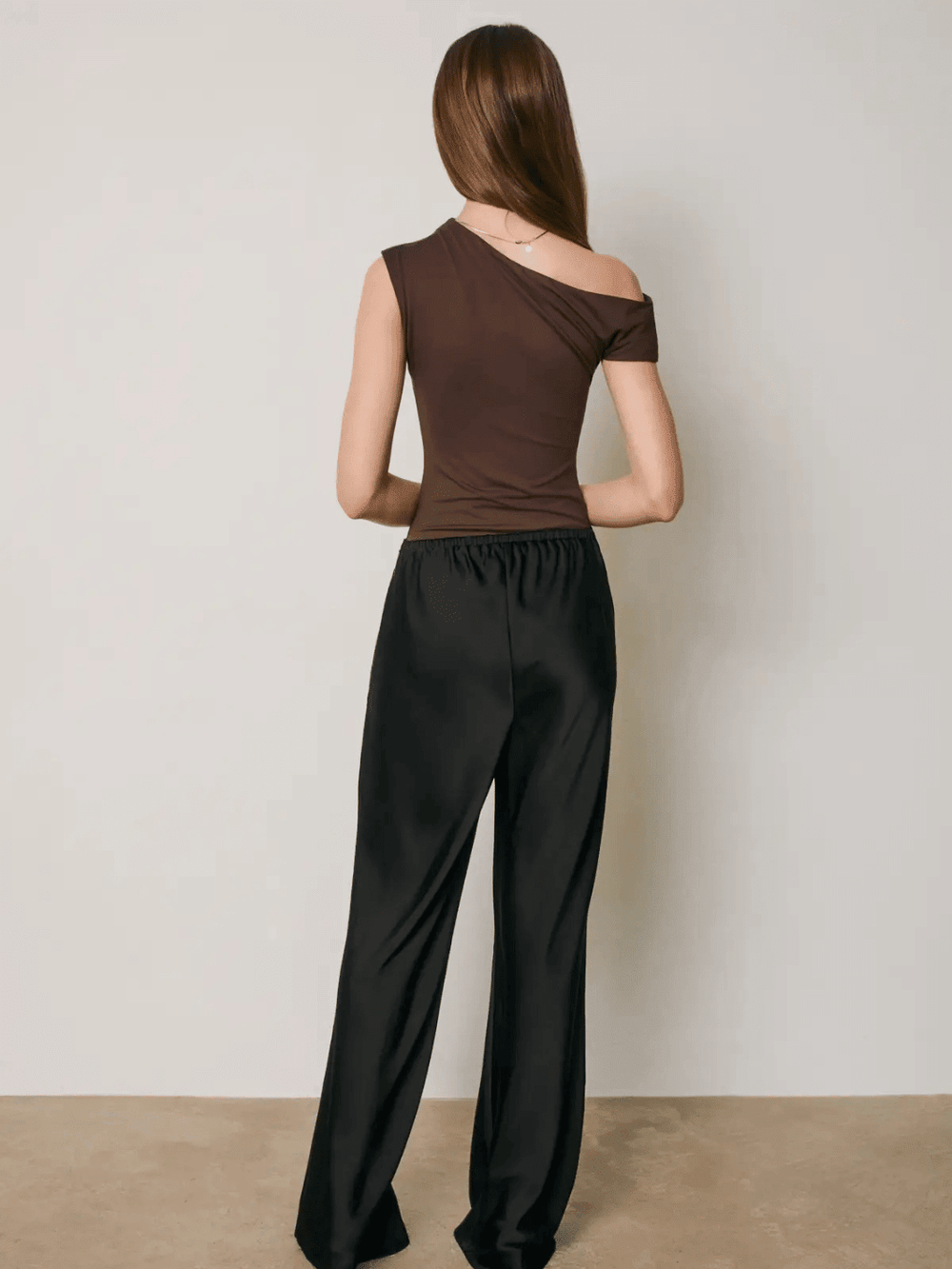 Back view of Women's The After Hours Satin Straight Leg Pants styled with brown top.