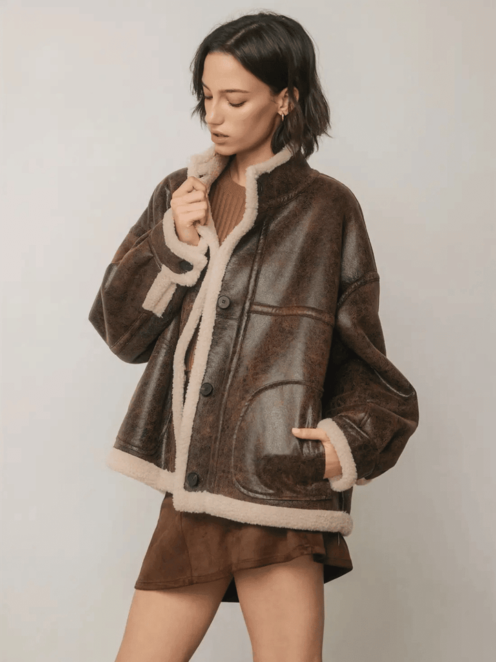 The Renegade Shearling Moto Jacket by Jayden P Boutique, relaxed front view highlighting oversized fit and cream sherpa lining.