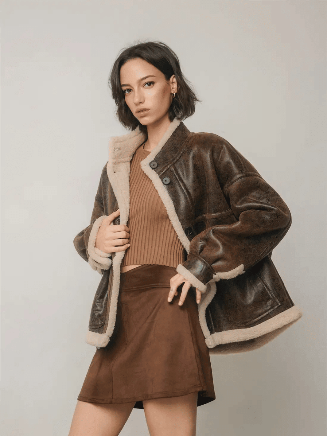 The Renegade Shearling Moto Jacket in distressed brown, front view with cream sherpa trim, styled by Jayden P Boutique.